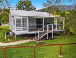 Life style business. Romantic cabins in picturesque farming landscape 